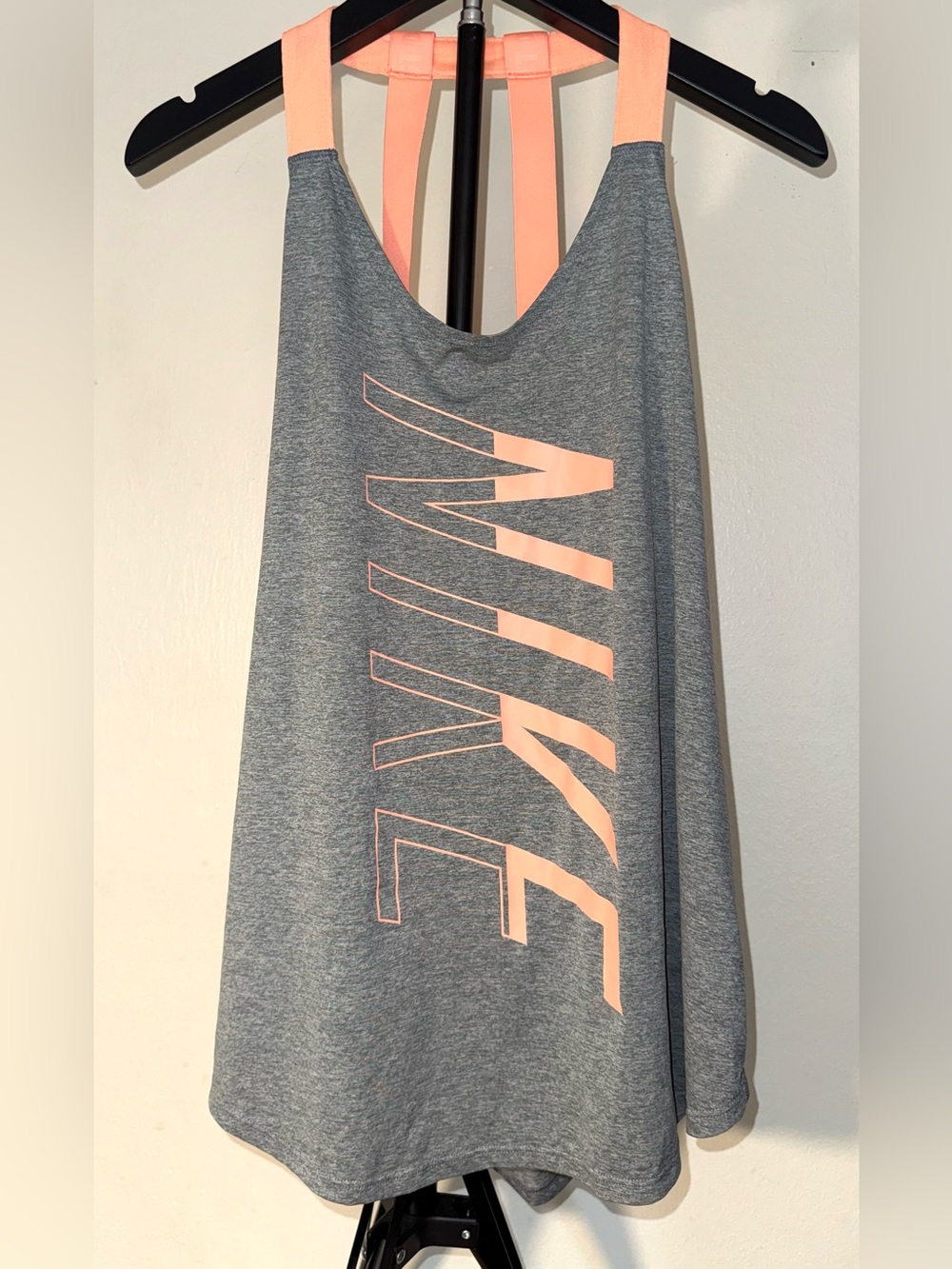 Nike Performance tank top features pink straps and vertical branding, size XL